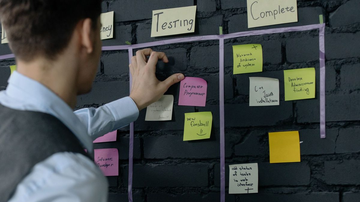 A project manager mapping out the tasks and phases for a mobile app build