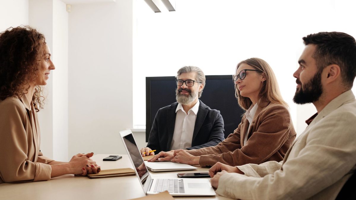 A group discussing project scope around a table
